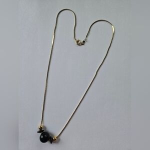 Elegant Gold and Black Necklace